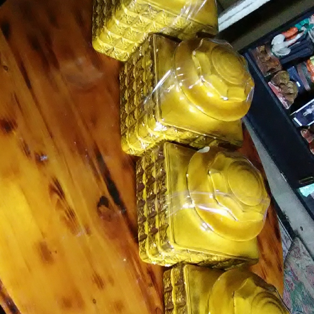 Gold canister set of 4 a few chips heavy